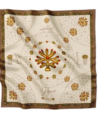 Luxurious beige silk scarf adorned with golden traditional motifs, intricate ornaments, and decorative patterns, exuding elegance and sophistication.