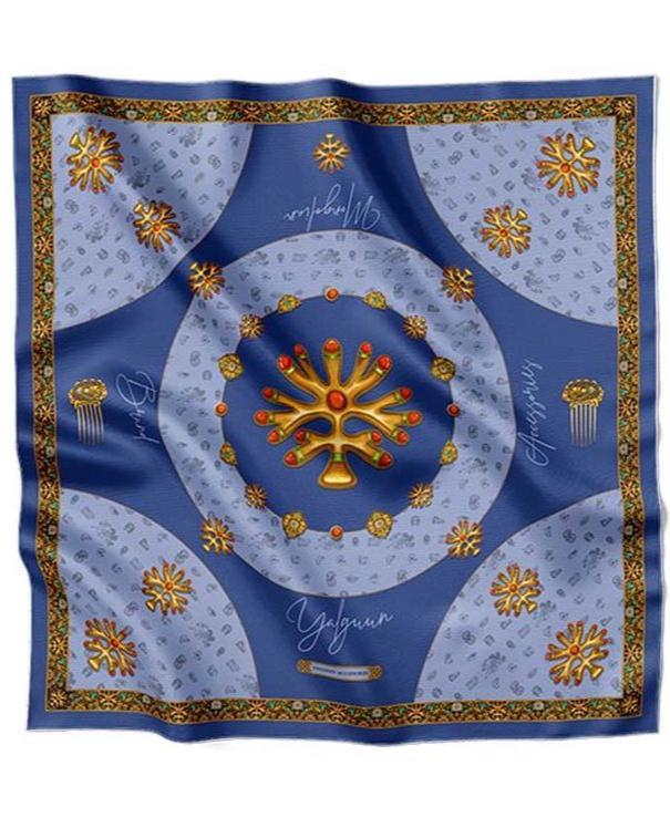 Luxurious blue silk scarf adorned with golden traditional motifs, intricate ornaments, and decorative patterns, exuding elegance and sophistication.