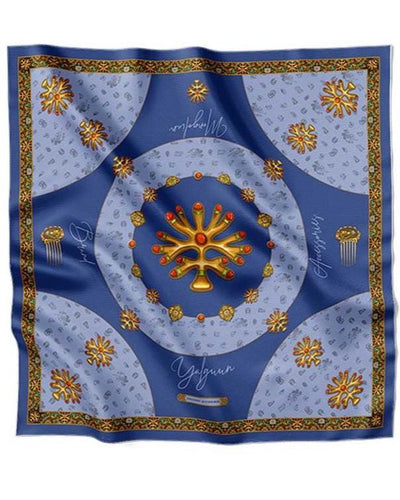 Luxurious blue silk scarf adorned with golden traditional motifs, intricate ornaments, and decorative patterns, exuding elegance and sophistication.