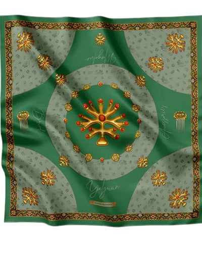 Luxurious green silk scarf adorned with golden traditional motifs, intricate ornaments, and decorative patterns, exuding elegance and sophistication.