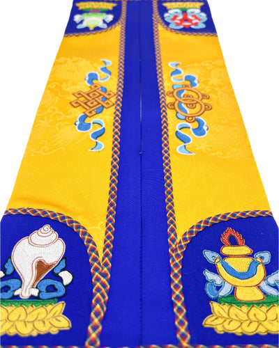 Made by Yellow and blue silk with The Spirit Horse, the Four Mighty Creatures, the Eternal Knot, the King's Bracelet, and the Queen's Chariot are intricately embroidered. The design is finished with fishbone stitching and decorated with a coin braid stitch.