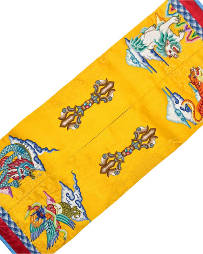 Mongolian Three Traditional Sports (archery, wrestling and horse racing), the Four Mighty Creatures, and the Vajra pattern are intricately embroidered with fine threads. The design is finished with fishbone stitching and decorated with a coin braid stitch on yellow silk.