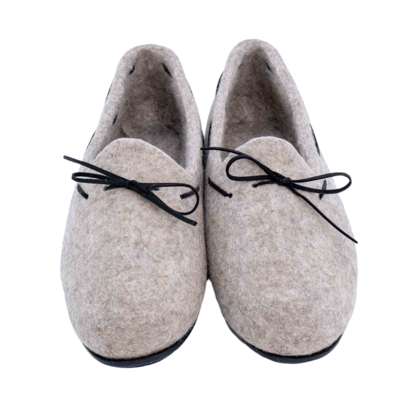Top-down view of felt loafers with black bow accents, made in Mongolia, displayed on a white background.