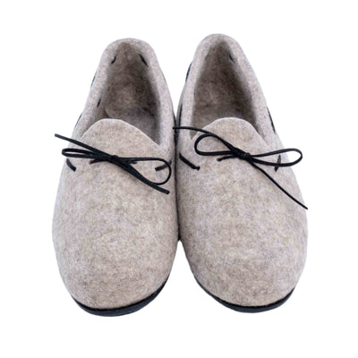 Top-down view of felt loafers with black bow accents, made in Mongolia, displayed on a white background.