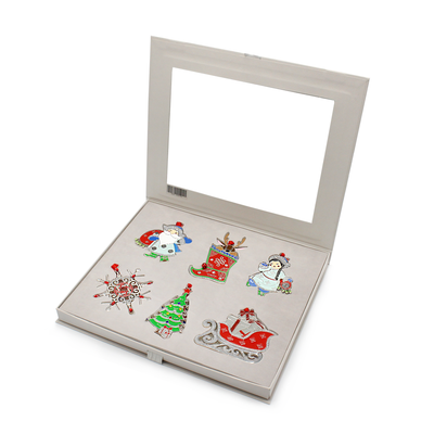Set of six Mongolian Christmas tree ornaments featuring Santa, reindeer sleigh, decorated tree, and festive designs in a gift box