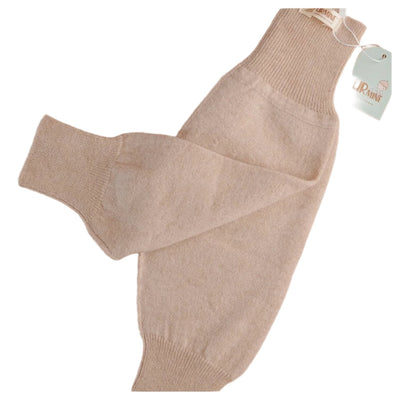 Soft beige baby cashmere pants featuring a ribbed waistband and ankle cuffs, designed for ultimate comfort and warmth.