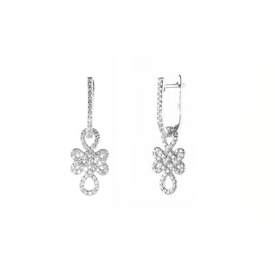 Ulzii sterling silver earrings featuring 14k white gold plating and zircon embellishments with a knot design.
