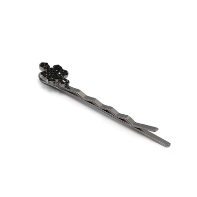 Ulzii hair pin featuring a sleek black metal finish, knot design, and sparkling black stone embellishments