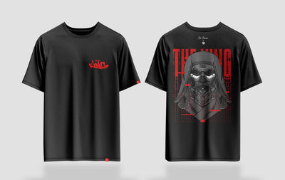 Black t-shirt featuring a bold graphic design of a king in red and gray tones, labeled “The King. This shirt showcases intricate graphic art of a king with a modern, edgy twist
