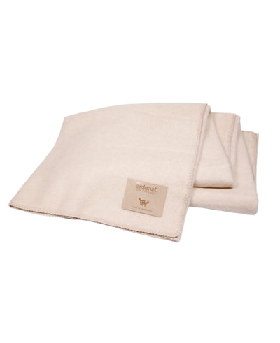 Beige cashmere blanket with stitched edging, made in Mongolia, offering luxurious warmth and softness